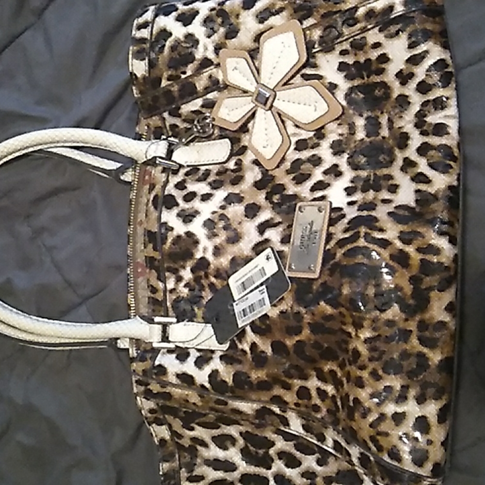 Purse . Guess ,natural leo , hula girl medium